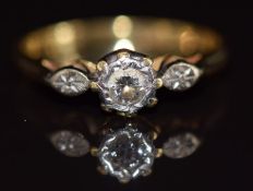 An 18ct gold ring set with a diamond of approximately 0.15ct in a platinum setting, 2.8g, size N
