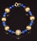 A bracelet made up of textured gold beads and blue beads, 12.6g, 20cm