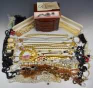 A collection of costume jewellery including vintage earrings, vintage necklaces, silver bangle