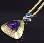 An 18ct gold necklace set with a trilliant cut amethyst measuring approximately 18mm surrounded by
