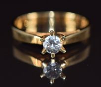 An 18ct gold ring set with a round cut diamond of approximately 0.28ct, with certificate, 3.4g, size