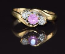 A 9ct gold ring set with a pink sapphire and diamonds, 2.3g, size L