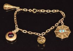 Victorian charm bracelet with four charms including a spider's web set with a turquoise and pearl in
