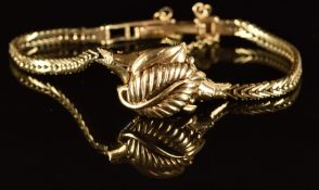 Rotary 9ct gold ladies wristwatch with foliate dial cover, gold hands and hour markers, silver