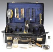 Leather travelling vanity case with fitted interior and contents, together with a green leather