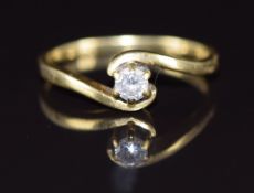 An 18ct gold ring set with a diamond of approximately 0.14ct in a twist setting, 2.4g, size M
