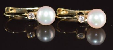 A pair of 18ct gold earrings each set with a pearl and diamond by Mille Perle, 2.6g