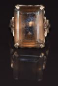 A 9ct gold ring set with an emerald cut smoky quartz, 6.3g, size J