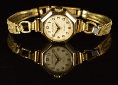 Rotary 9ct gold ladies wristwatch with gold hands and Arabic numerals, silver dial, octagonal case