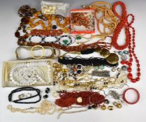 A collection of costume jewellery including vintage earrings, vintage brooches, beads, 1980's