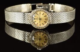 Omega 18ct white gold ladies wristwatch with diamond set case, black hands and hour markers,