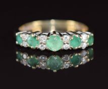 A 9ct gold ring set with diamonds and emeralds, the total diamond weight approximately 0.12ct, 2g,