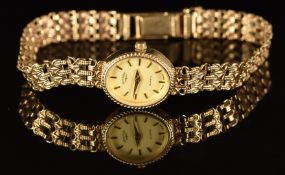 Rotary 9ct gold ladies wristwatch with gold hands, hour markers and dial and quartz movement, on 9ct