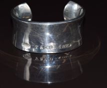 A silver cuff bangle marked Tiffany & Co, with feature hallmarks, 104g
