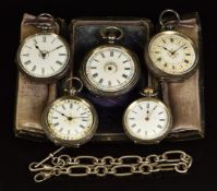 Five silver pocket watches, most with gilt and floral decoration including one in travel stand and