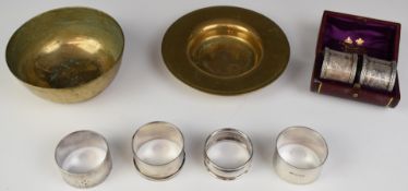 Six hallmarked silver napkin rings including a cased pair of Victorian examples, the box marked F.