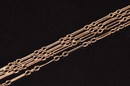 A c1900 9ct rose gold guard chain made up of oval and elongated links,160cm long, 17.4g