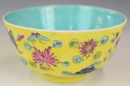 Chinese pedestal dish with enamelled floral decoration against a yellow ground and four character