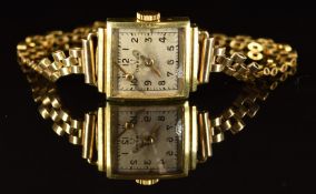 Omega ladies wristwatch with gold hands and Arabic numerals, silver dial and signed 15 jewel
