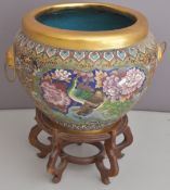 Chinese cloisonné jardinière decorated with peacocks and birds amongst flowers and lion mask handles