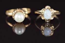 A 9ct gold ring set with an opal (1.9g, size J) and a yellow metal ring (testing as 14k) set with