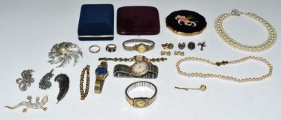 A collection of jewellery including two Sarah Coventry brooches, three silver charms, silver ring