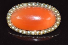 A 9ct gold brooch set with foiled agate surrounded by split pearls, 7.2g, 3cm