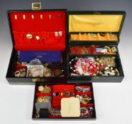 A collection of costume jewellery including silver chains, beaded necklaces, vintage brooches,