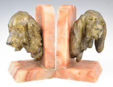 After Prosper Lecourtier (French 1851-1924) Art Deco pair of pink onyx and bronzed spelter bookends,