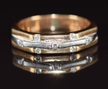 An 18ct bi-coloured gold ring set with seven diamonds, 5.5g, size L