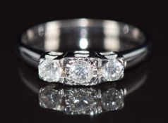 A 9ct white gold ring set with three round brilliant cut diamonds, totalling approximately 0.5ct,
