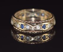 A 9ct gold eternity ring set with sapphires and spinel, 2.9g, size M