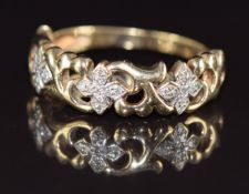 A 9ct gold ring set with diamonds in a pierced setting, 2.7g, size O