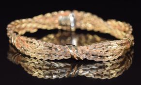 A 9ct gold bracelet made up of two plaited strands, by UnoAErre, 24g, 19cm long
