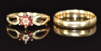 A 9ct gold wedding band / ring and a 9ct gold ring set with garnets, 3.9g, size N/O