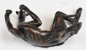 Bronze greyhound dog figure modelled on its back with legs in the air, MB MJ impressed marks, length