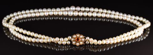 A double strand of cultured pearls with 9ct gold clasp set with a citrine and split pearls, 42cm