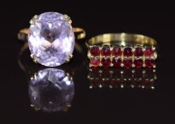 Two 9ct gold rings, one set with an oval cut amethyst one with two rows of garnets, 7g, size O & M