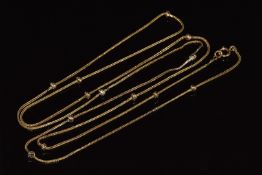 A 9ct gold c1910 necklace with knotted decoration, 6.1g, 94cm long