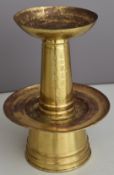 Chinese brass / bronze two tier incense burner decorated with script, on wooden stand, 56cm tall
