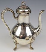 French silver coffee or similar pot of baluster form, raised on four lions paw feet, maker's mark