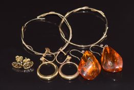 A pair of 18ct gold earrings in Greek key pattern (1.5g), two pairs of 9ct gold earrings (3.7g)
