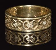 A 9ct gold ring with pierced decoration set with diamonds, 3.6g, size K