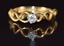 An 18ct gold ring set with a diamond of approximately 0.15ct in pierced setting, 2.9g, size M/N