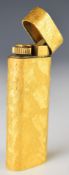 Cartier retro gold plated lighter with textured body, length 7cm