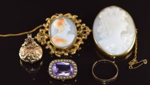 A 9ct gold fob / seal set with smoky quartz, Edwardian brooch set with an amethyst surrounded by
