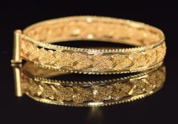 A 22k gold Indian bangle in a plaited design, 27.7g, 5.8cm