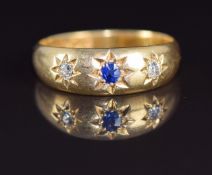 Victorian 18ct gold ring set with a sapphire and diamonds in a star setting, London 1898, 4.3g, size