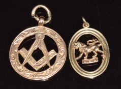 A 9ct rose gold Masonic pendant and 9ct gold pendant in the form of a lion reading 'Leo', 5.7g