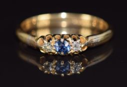 A c1920 18ct gold ring set with a sapphire and diamonds, 2.7g, size N